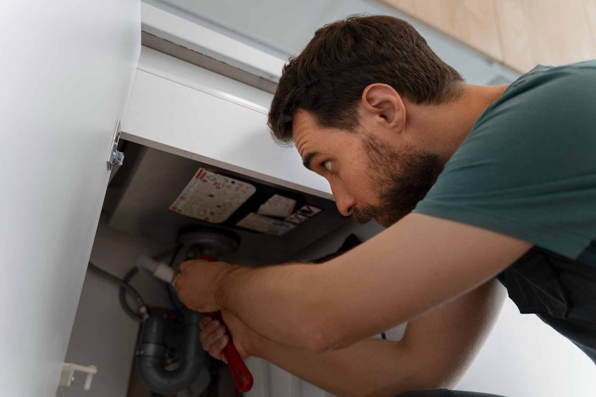 low-angle-man-working-as-plumber